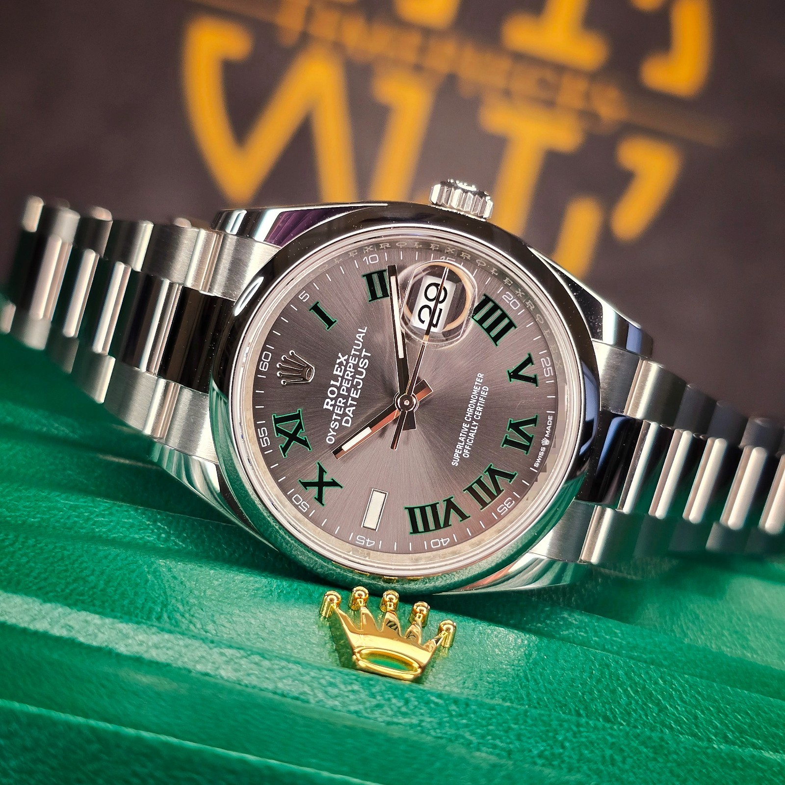 Rolex Datejust 36 with silver Wimbledon dial and green Roman numerals on a steel bracelet