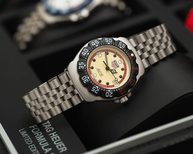 TAG Heuer Formula 1 x KITH on a steel bracelet, cream dial with black bezel, in its presentation box